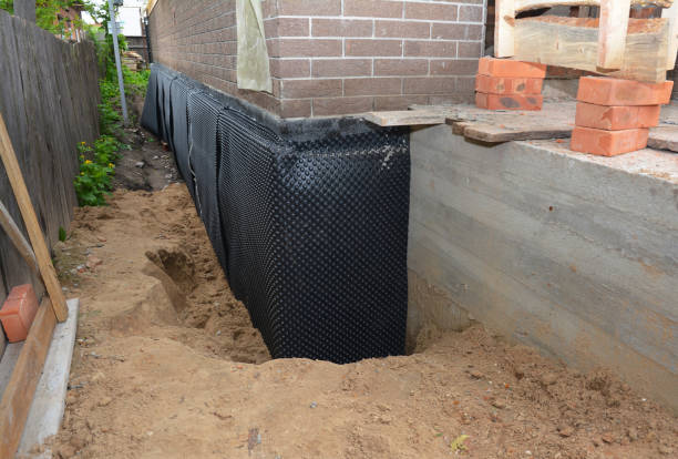 SJ Waterproofing Pros technician performing targeted Wet Basement Repair assessment in Hopewell, OH